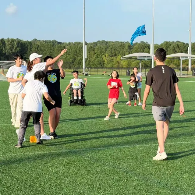 A group taking part in a scarf-toss activity