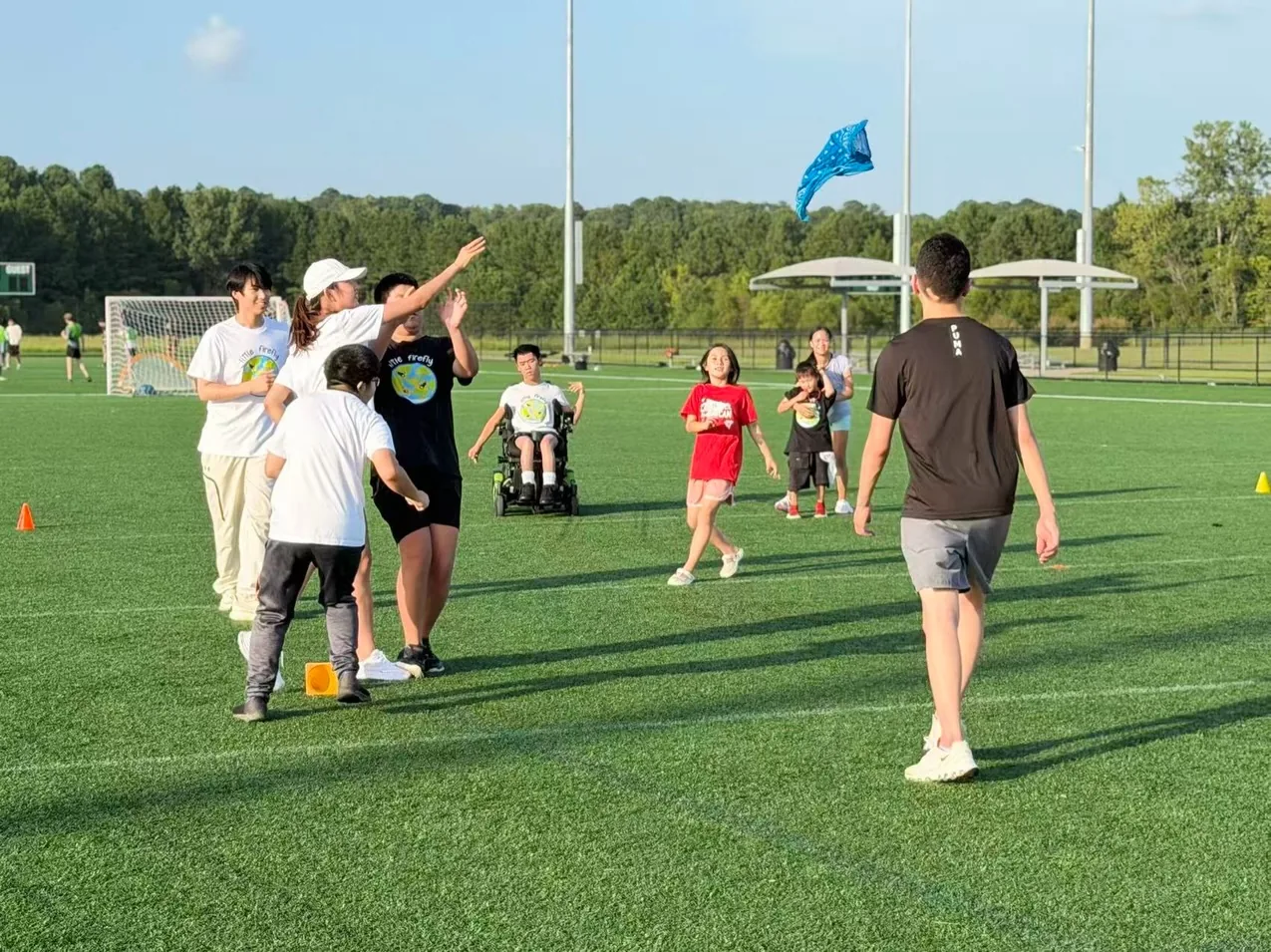 A group taking part in a scarf-toss activity