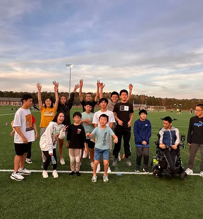 Little Firefly participants and volunteers gathered after an outdoor activity